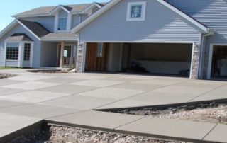 house with new concrete driveway