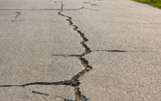 concrete driveway with cracks