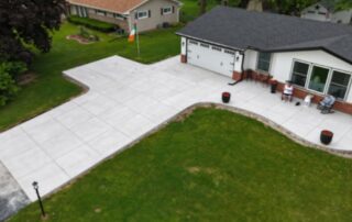Aerial view of a new concrete driveway and walkway installed by JBS Construction in Germantown, WI