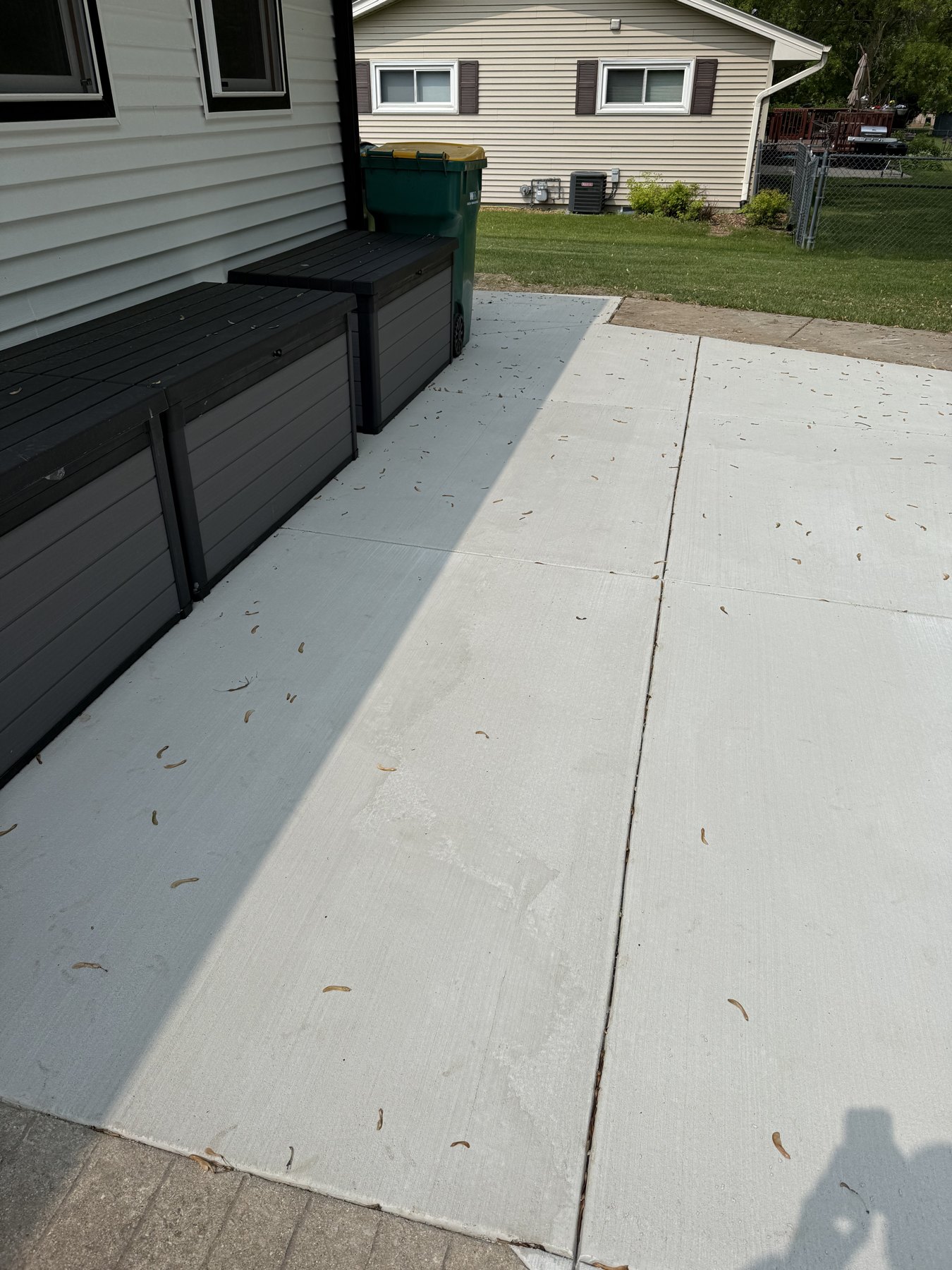 A concrete connection along the side of the home.