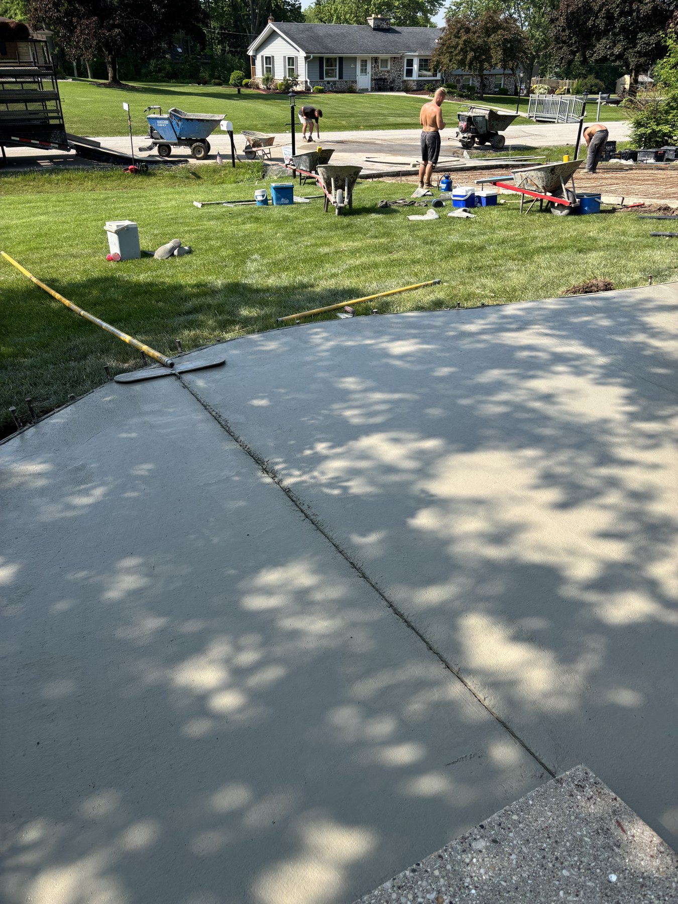 Freshly placed concrete along the front walkway.